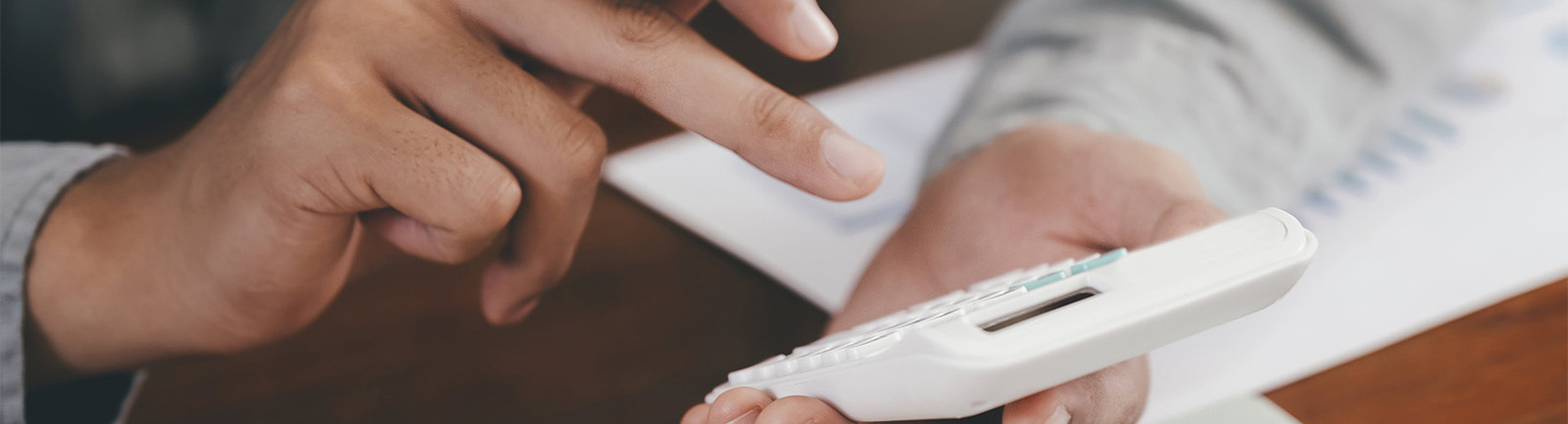 a person holding a calculator