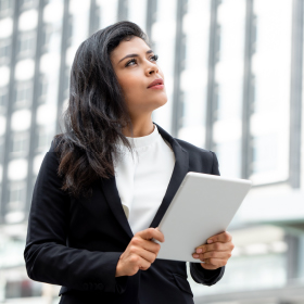young woman Hispanic woman holding a tablet