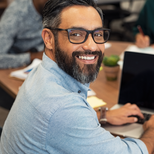 Indian man wearing glasses smiling
